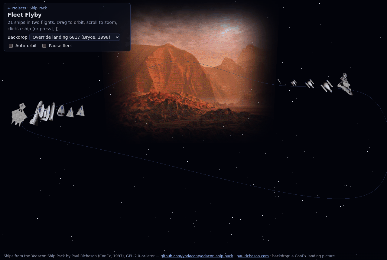 Two formations of ships flying past a red canyon landing picture